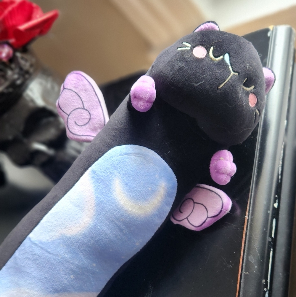 Black Plush Cat Pillow with Purple Wings and Blue Belly